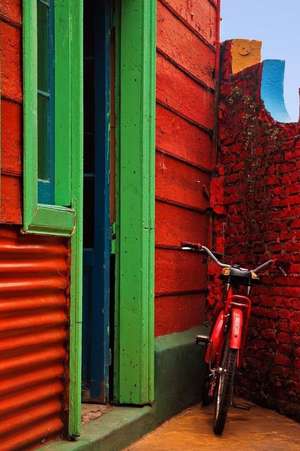 Red Bicycle Against a Red Wall Journal de Press, Benton