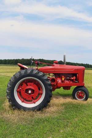 A Bright Red Tractor on a Farm in Delaware USA Journal de Cs Creations